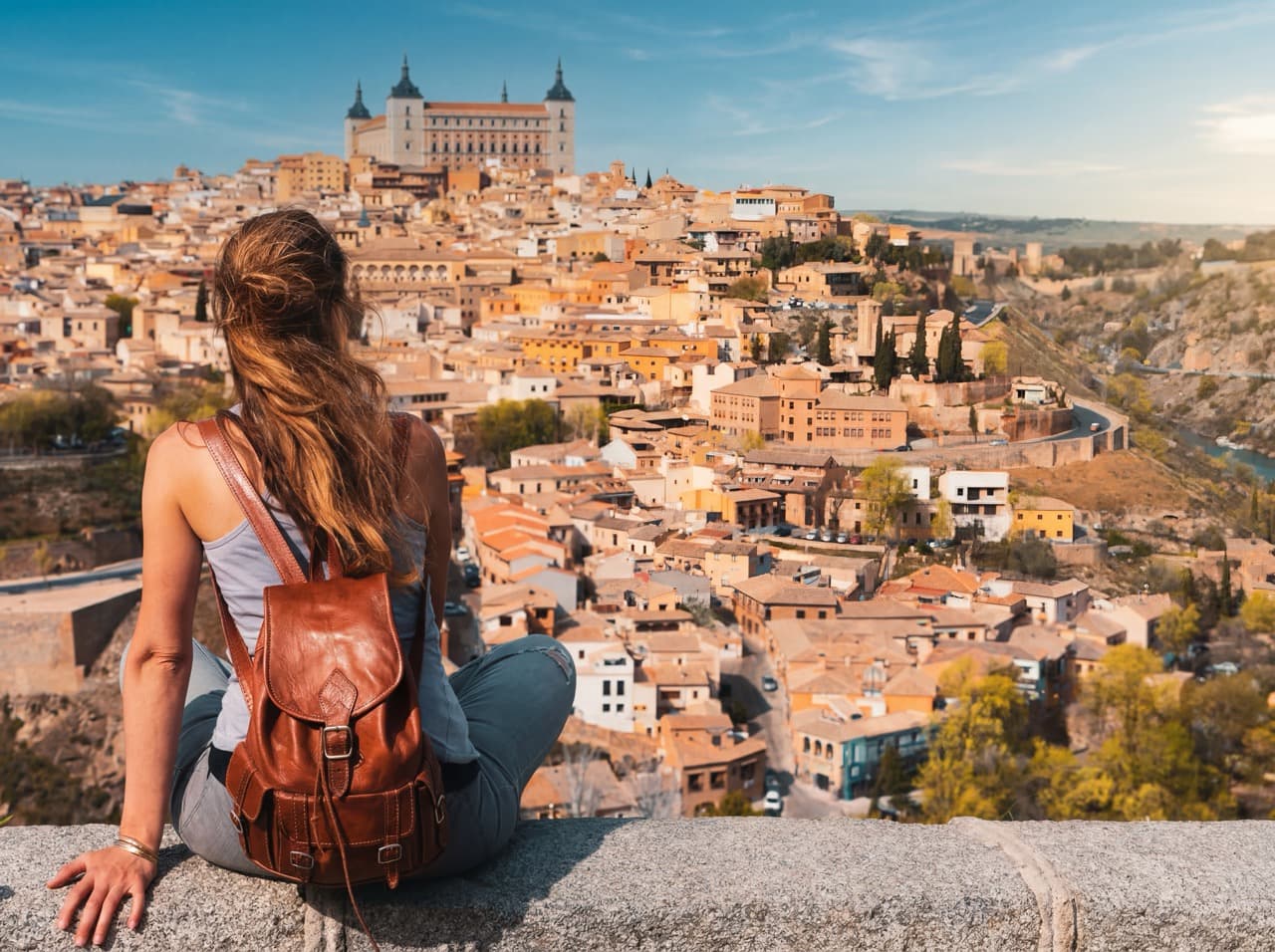 Traveler contemplating Toledo from the viewpoint
